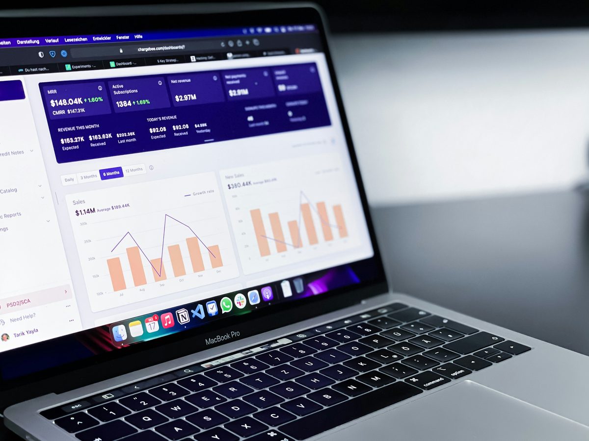Laptop showing charts and numbers